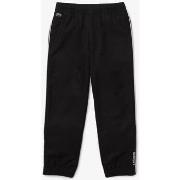 Pantalon enfant Lacoste PANTALON DE SURVÊTEMENT BLEU MARINE AVEC LISER...