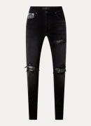 AMIRI MX1 skinny jeans met gekleurde wassing en destroyed afwerking